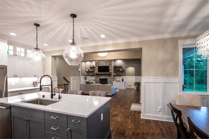 From the kitchen, you have a great view of the living room that's warmed by a stone fireplace.