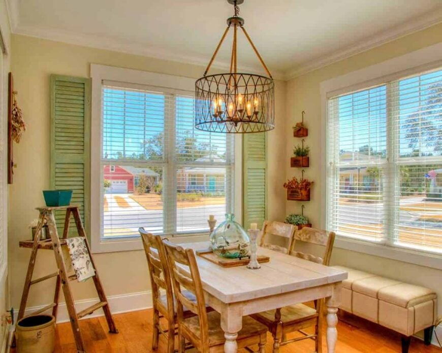 Another look at the dining area showing the storage bench and a wooden ladder that doubles as a rack.