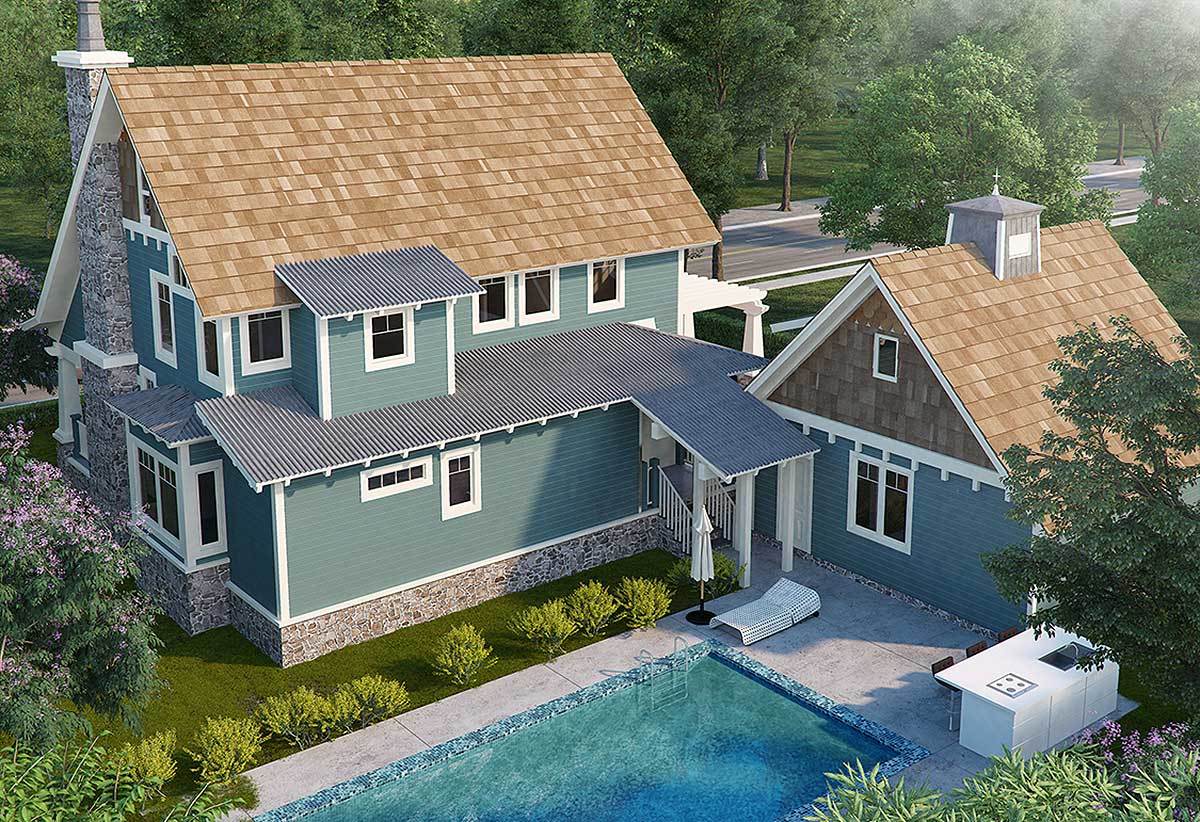 Home's rear view showing the covered porch and a sundeck with a bar and a sparkling swimming pool.