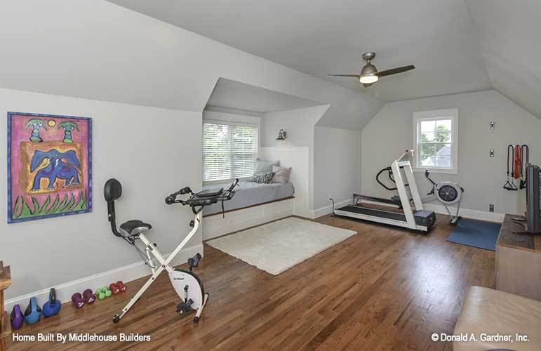 The bonus room is turned into an exercise room with a window seat.