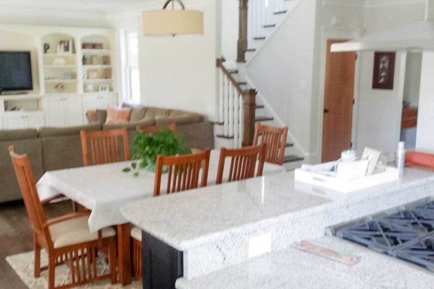 An open layout view showing the kitchen, dining area, and the living room.