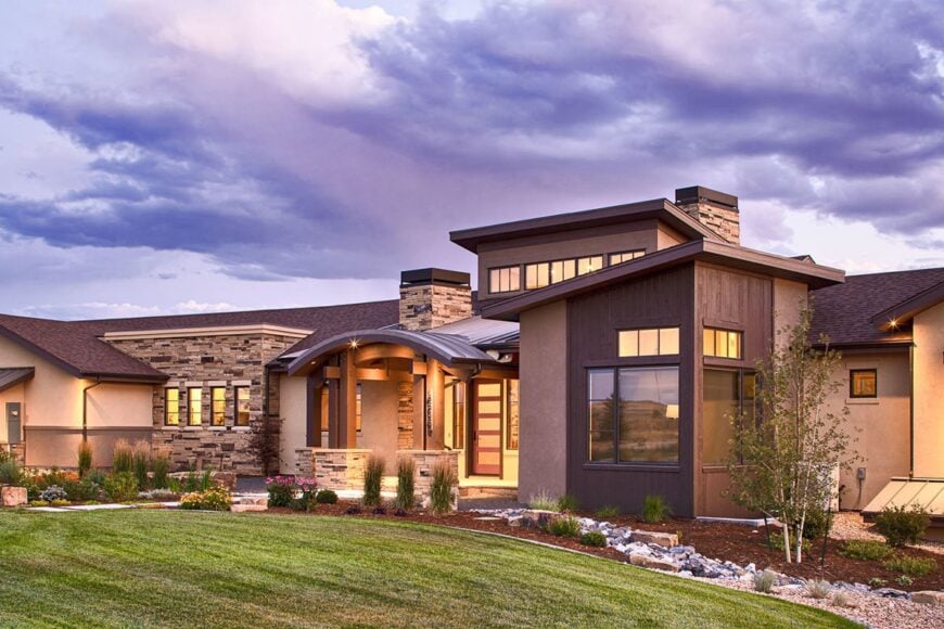 Home facade accentuated with striking stones and decorative wood trims.