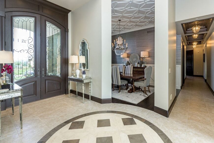 The opposite side shows the formal dining table defined with a concrete pillar.