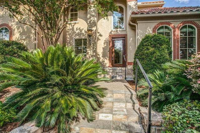 The home entry with a glazed front door is accessible via a tiled staircase.
