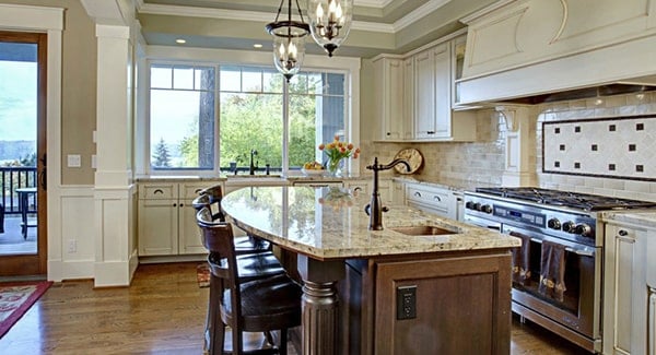 A pair of glass pendants hanging from the step ceiling illuminate the center island.