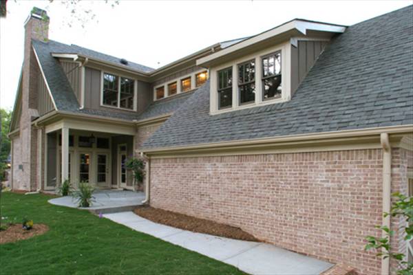 This side of the house showcases an open patio and a screened porch.