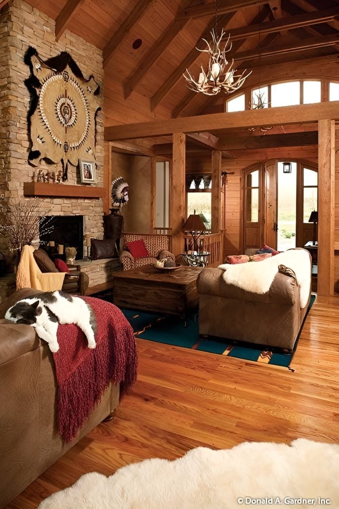 An antler chandelier that hangs from the beamed cathedral ceiling illuminates the living area.