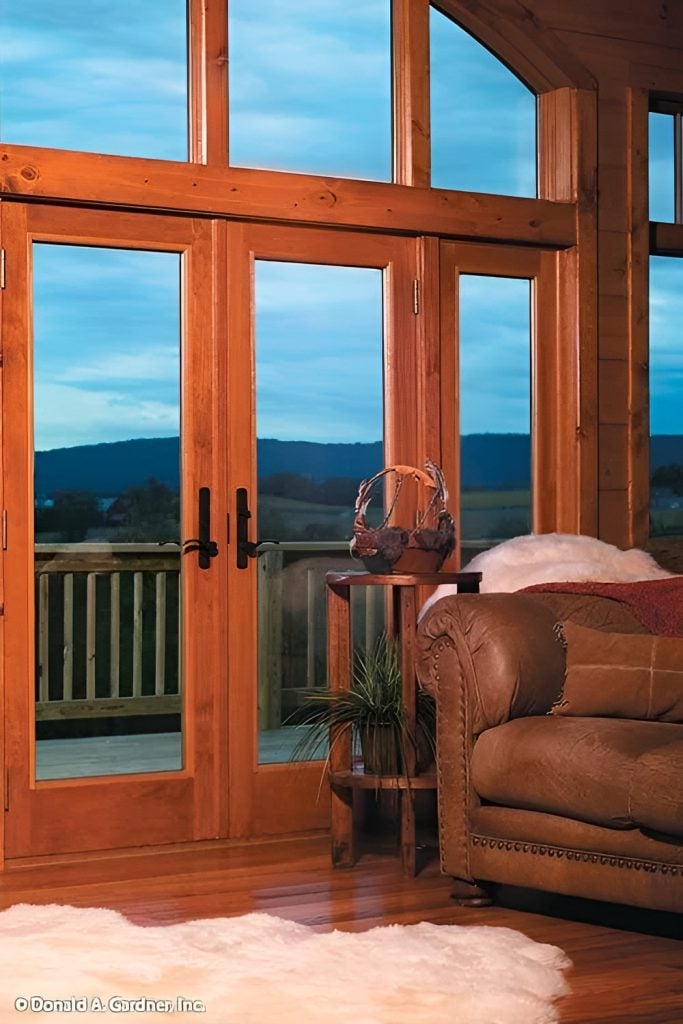 Massive windows along with a french door that leads out to the balcony provide a panoramic view of the serene surrounding.