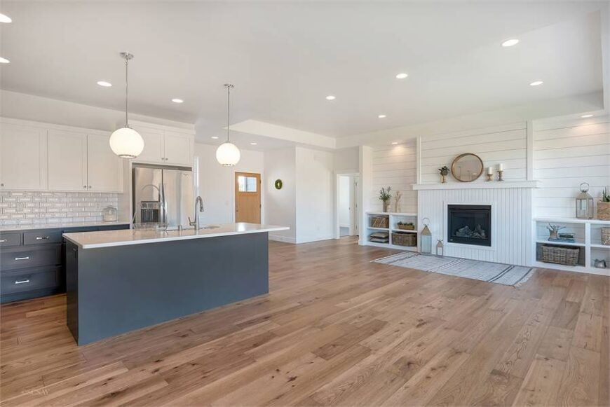 An open layout view showing the foyer, kitchen, and living room.