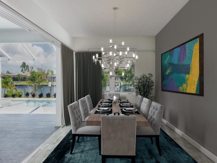 The dining room offers a rectangular dining table, gray tufted seats, and a contemporary chandelier.