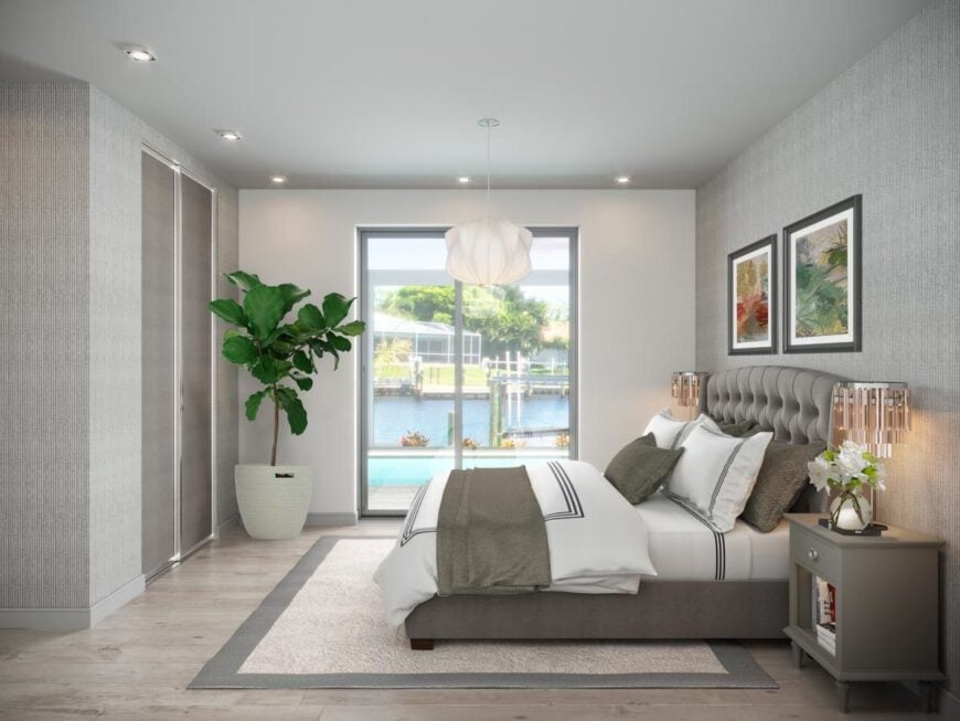 Primary bedroom with a fiddle-leaf fig plant, bordered area rug, and a tufted bed flanked with matching nightstands.