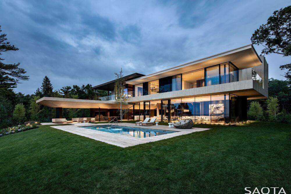 Outside view of the house boasting its contemporary architecture and its outdoor amenities.