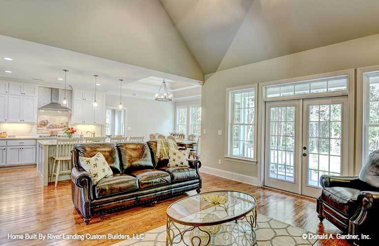 A white french door on the side opens out to the rear porch.