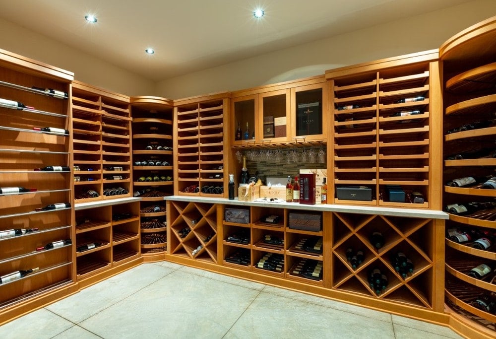This is the large wine cellar with large wooden structures lining the walls for wine storage. Image courtesy of Toptenrealestatedeals.com.