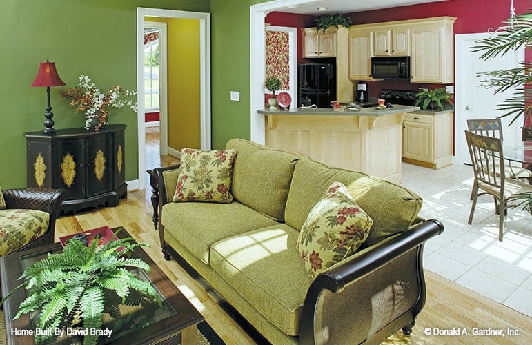 An open layout view showing the living room, kitchen, and dining area.