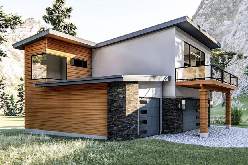 Angled front view with a three-car garage and a spacious deck supported by decorative columns.