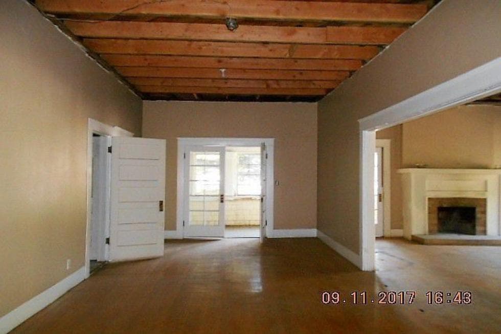 This is a spacious area that can be fitted with a dining area and a living room area with a fireplace on the far side. Image courtesy of Toptenrealestatedeals.com.