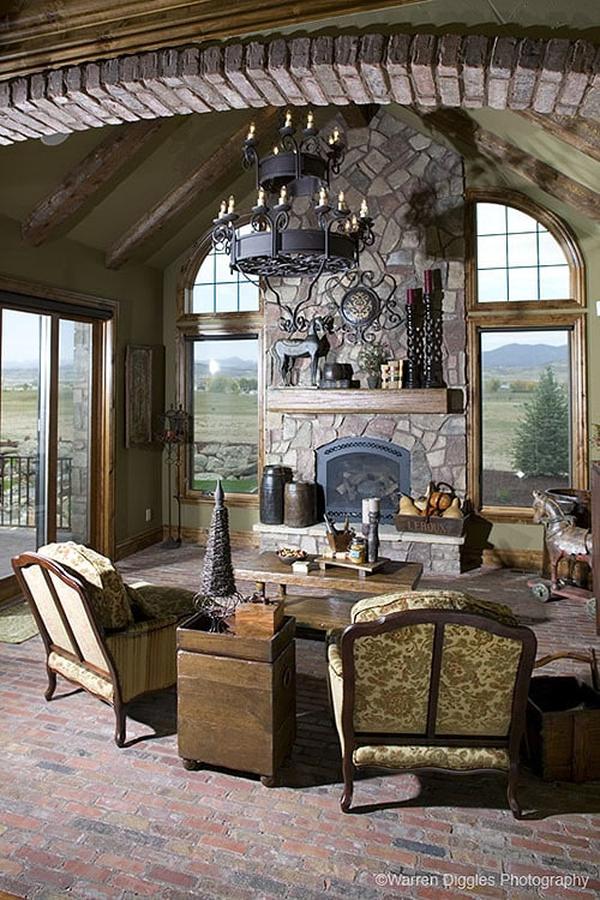 An abundance of natural light flows in from the glass windows and doors of the living room.