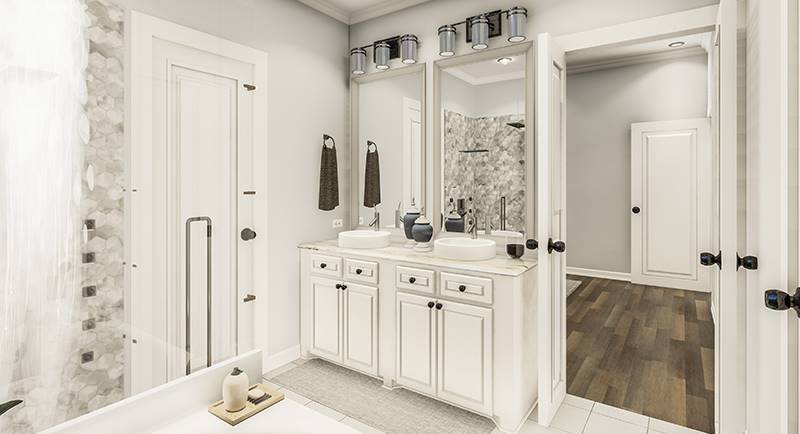 His and her vanity with white cabinets, vessel sinks, and framed mirrors.