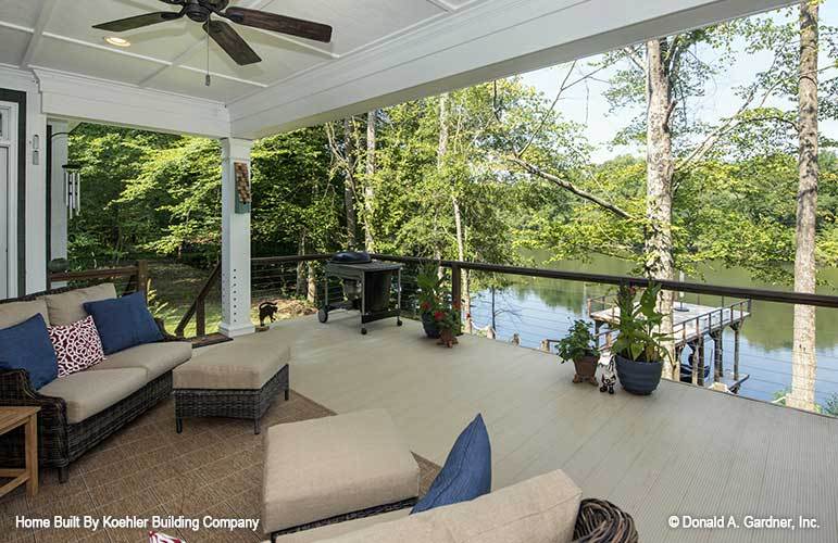 The rear porch has a magnificent view of the nearby lake.