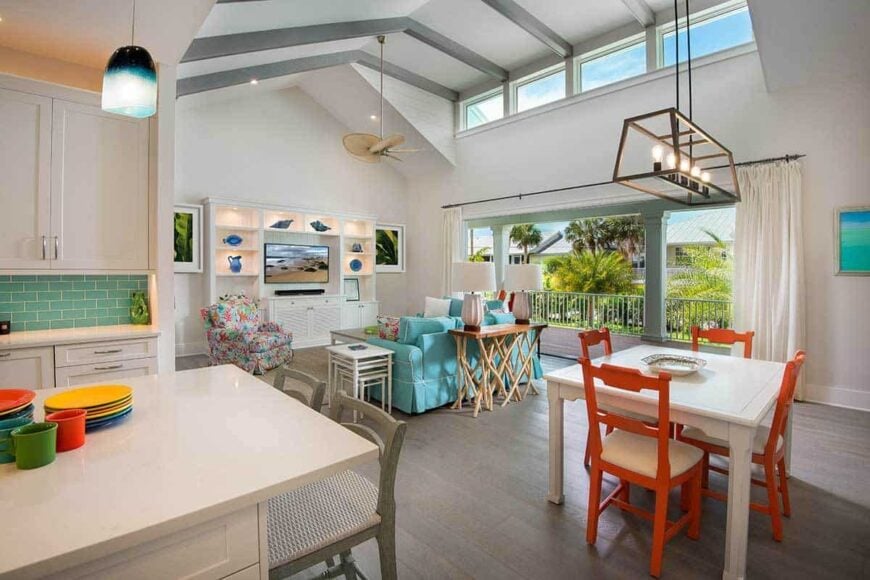 An open layout view showing the living room, dining area, and kitchen.