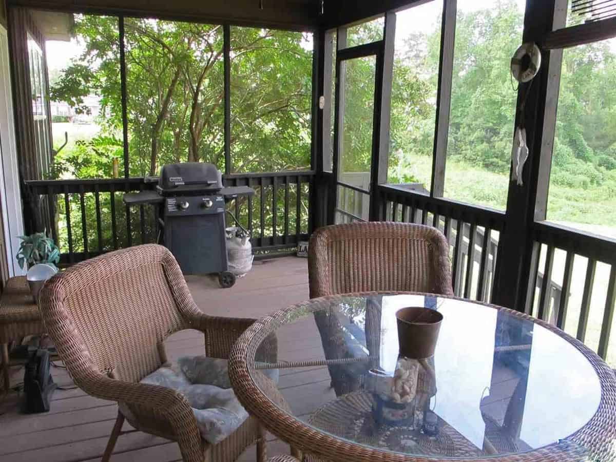 A barbecue grill completes the screened porch.