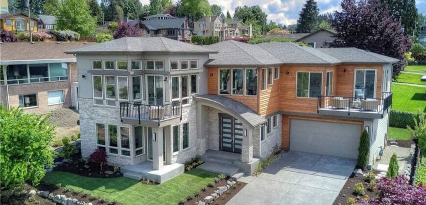 Aerial view of the house showing the verdant garden and neighboring houses.