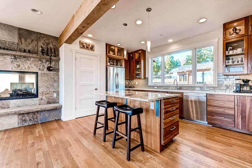 The white door next to the fireplace opens to the walk-in pantry.
