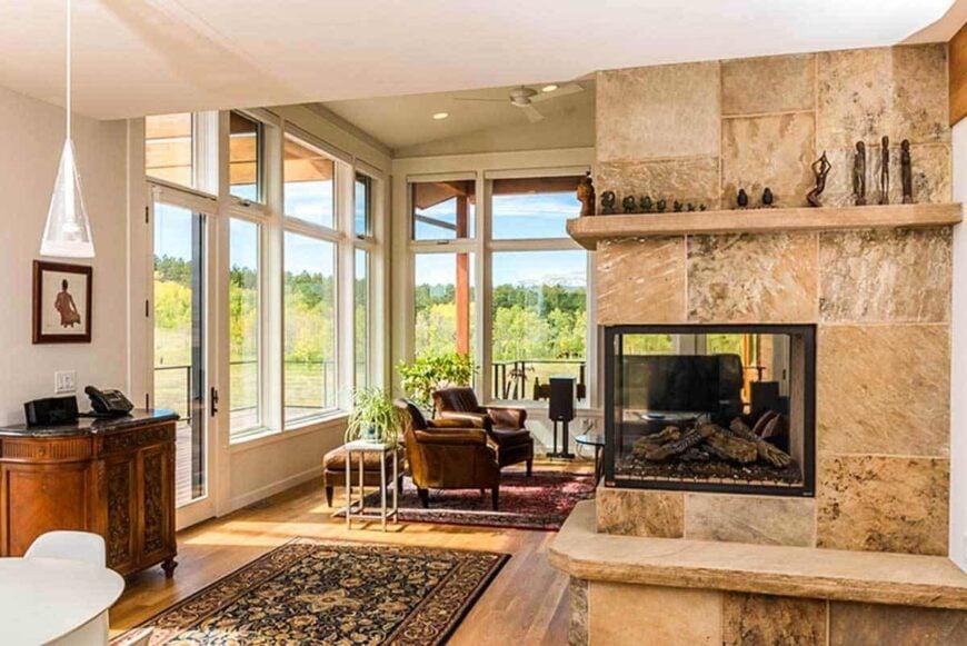 The triple fireplace in the kitchen and dining area is shared by the great room across.
