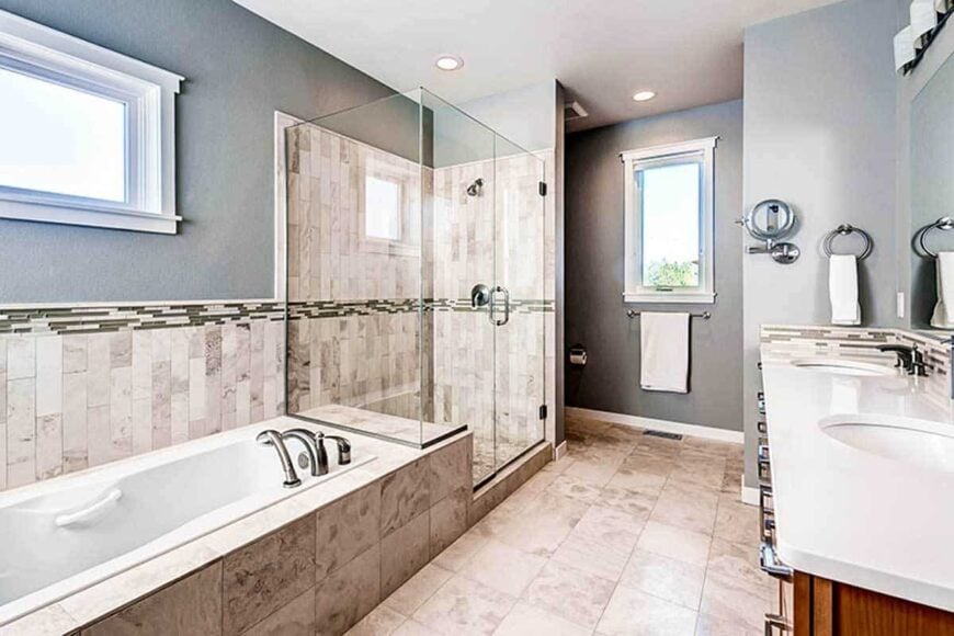 Opposite view of the primary bathroom showing the toilet area concealed by the walk-in shower.
