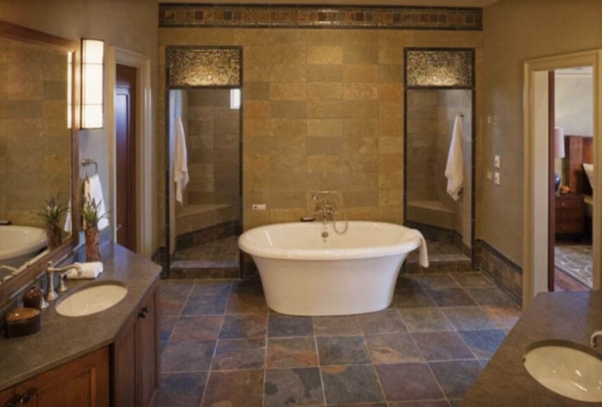 Primary bathroom with two wooden vanities, a toilet room, a freestanding tub, and a spacious walk-in shower.Primary bathroom with two wooden vanities, a toilet room, a freestanding tub, and a spacious walk-in shower.