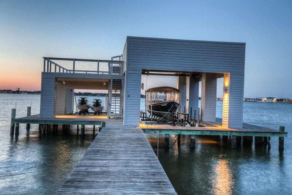 This is the boathouse at the end of the wooden walkway that can fit a boat and a couple of jet skis. Image courtesy of Toptenrealestatedeals.com.