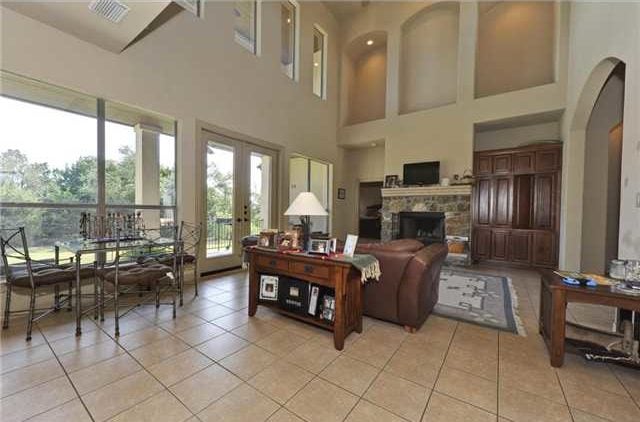 The breakfast nook behind the living area offers a metal dining table and cushioned chairs.