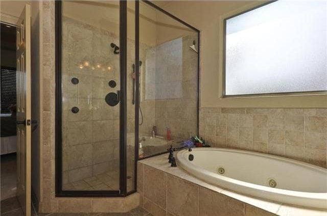 There's also a drop-in bathtub and a walk-in shower with wrought iron fixtures.