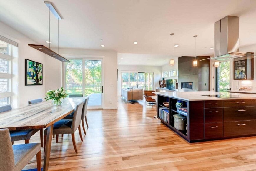 An open layout view showing the dining area, kitchen, and living room.