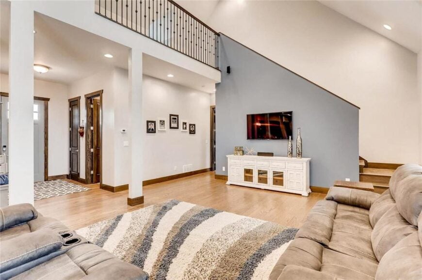 The opposite view shows the balcony loft encased in a wrought iron railing.