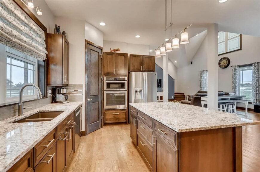 Slim white columns define the kitchen from the dining and living rooms.