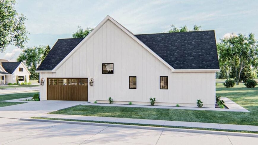 Side exterior view showing the double garage enclosed in wooden doors.