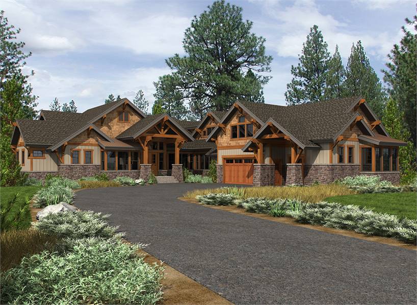 Front exterior view with multiple gables, vertical siding, tapered columns, and striking stone accents.