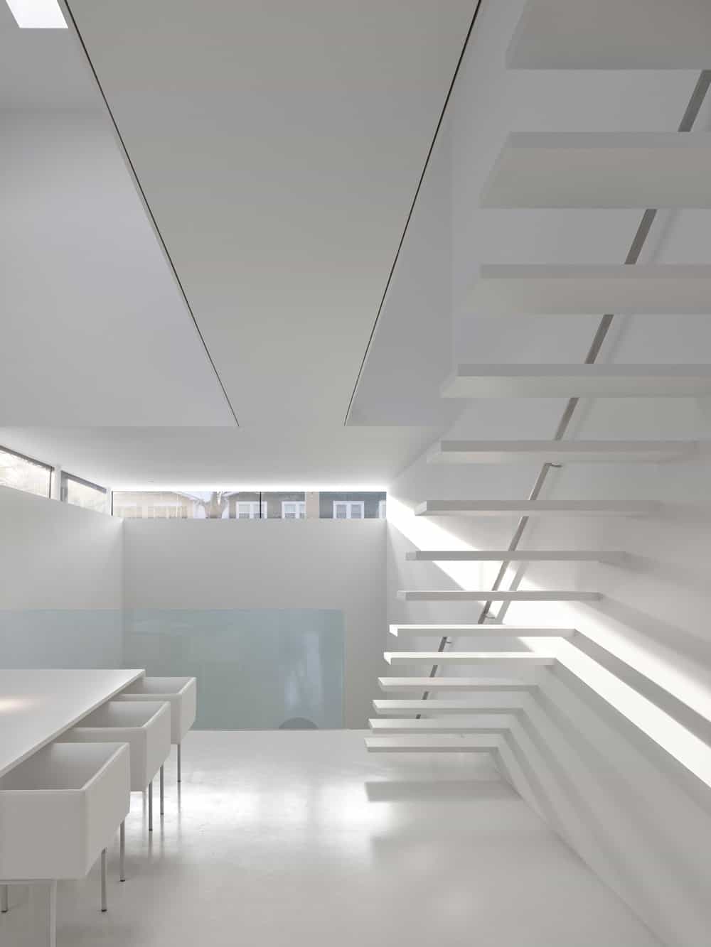 this view of the landing shows more of the dining set that has tones similar to the walls.