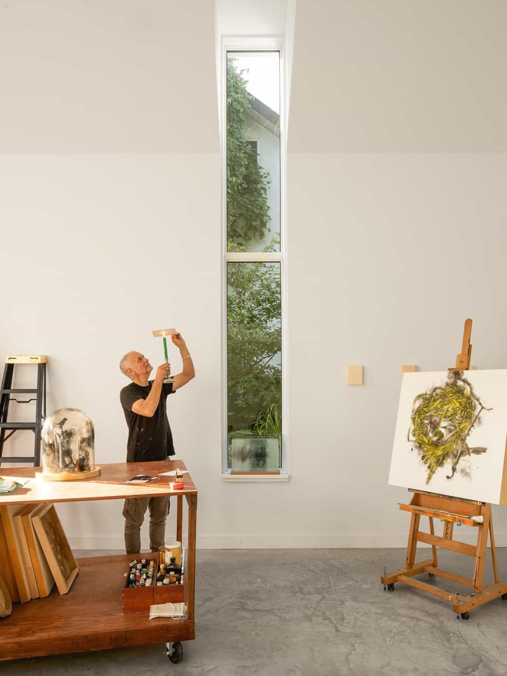 This shows the abundance of natural lighting that goes in from the large glass windows to complement the bright walls.