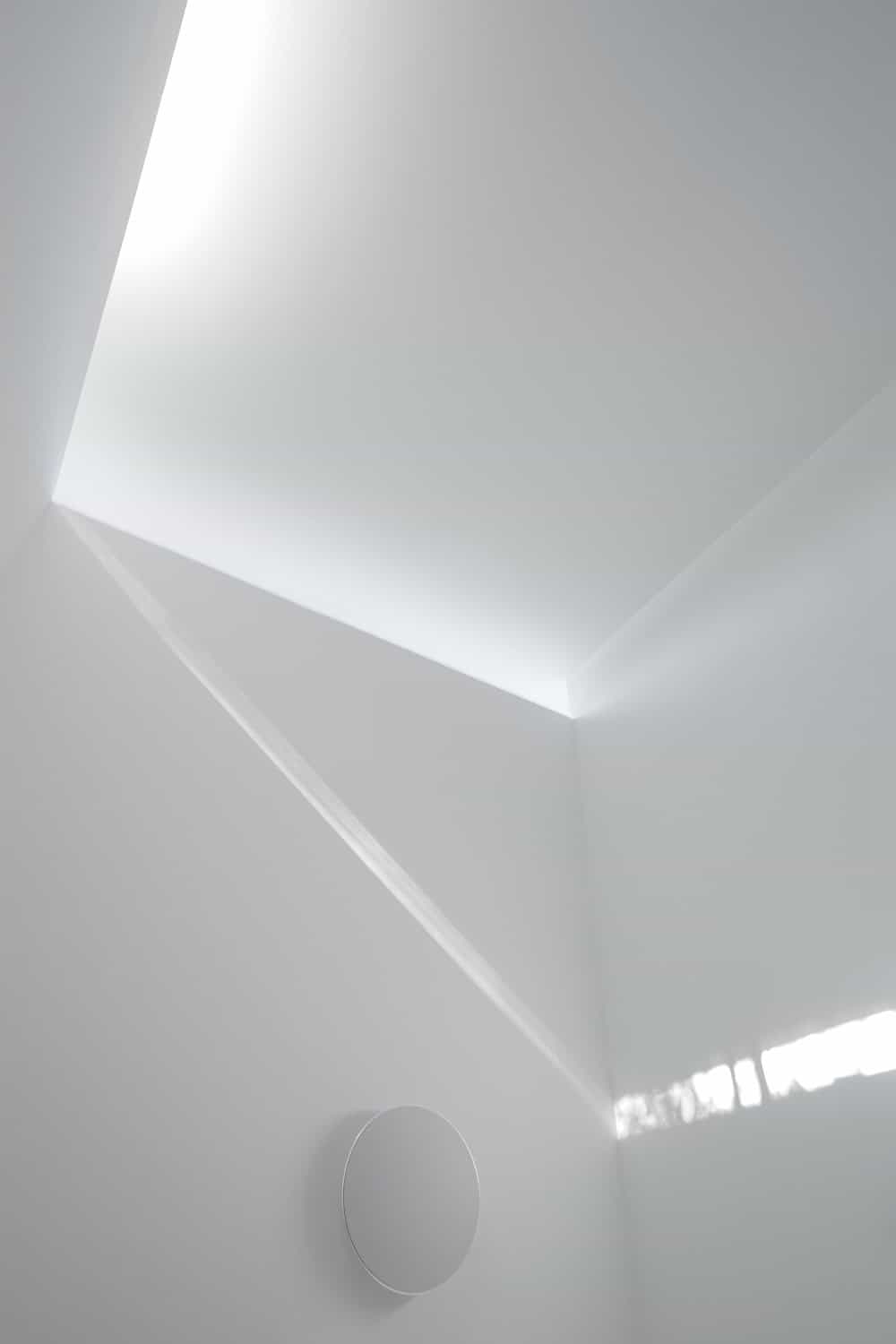 This is a view of the ceiling, its transom windows and the beam of light it produces.