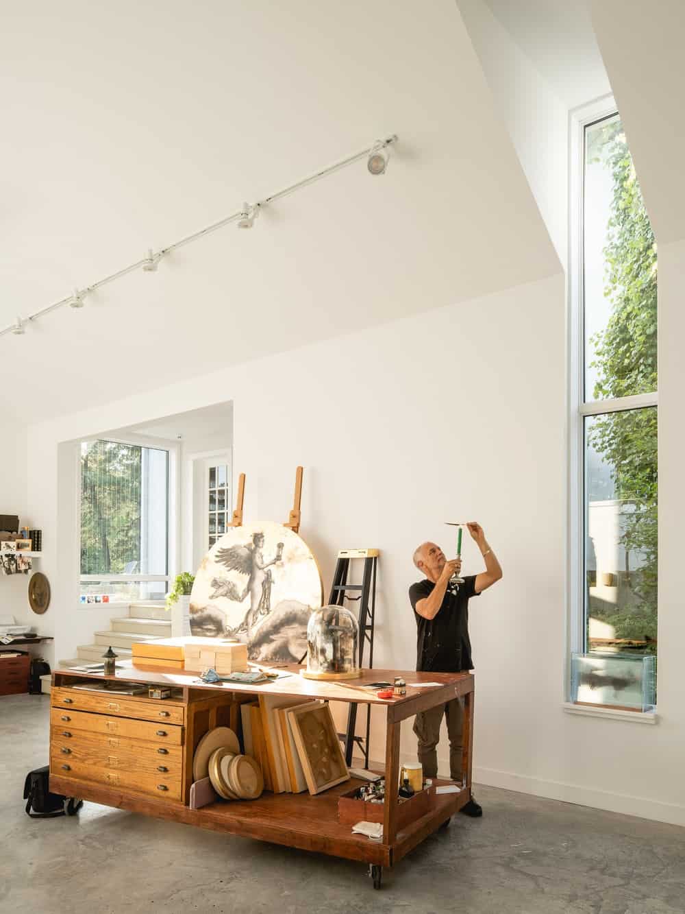 This side of the interiors shows the tall window that extends all the way to the ceiling.