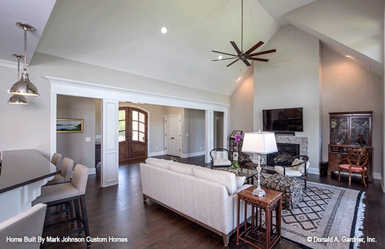 From the foyer, you have a great view of the open living space crowned by a vaulted ceiling.