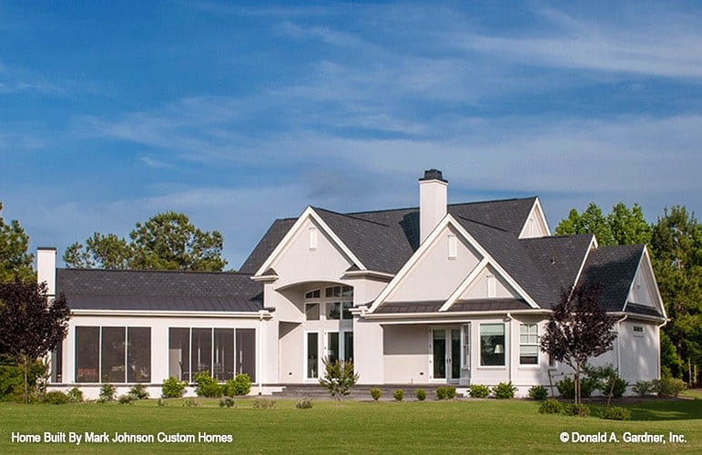 Side exterior view showing the screened porch and multiple gables in varied heights.