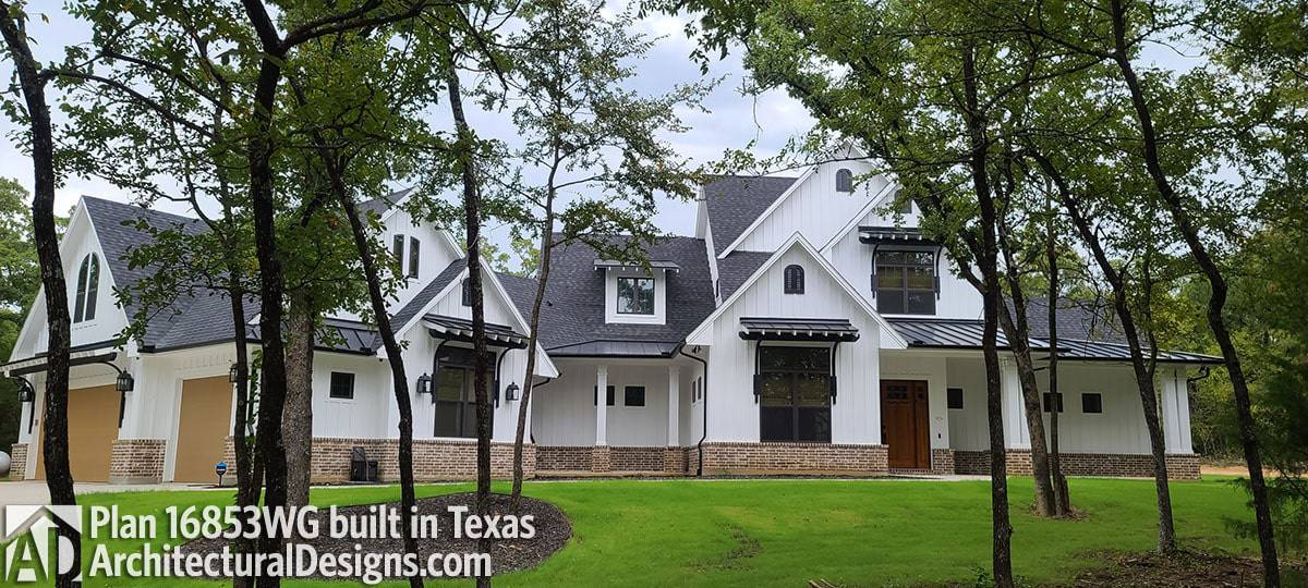 Brick bases and tiled roofs add texture to this white farmhouse.