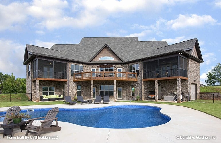 Welcoming Brick Facade with Resort-Style Pool Area