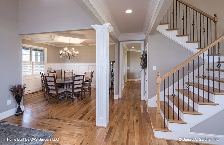 Elegant Dining Area with Intricate Staircase Design