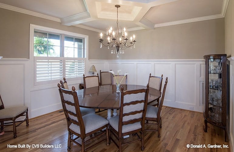 Elegant Dining Room with Wooden Table and Chandelier