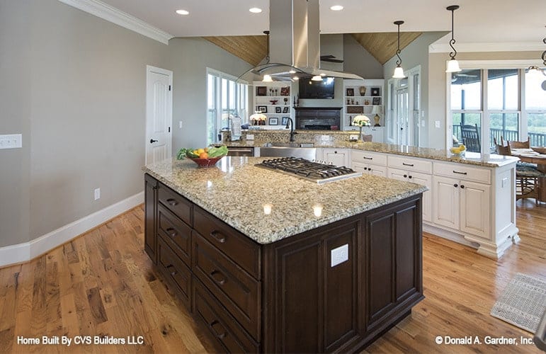 Spacious Kitchen with Granite Island and Fireplace